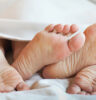 couple in bed feet