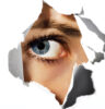 an eye peeking throw a hole in the paper