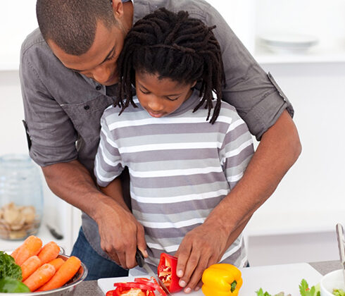 father son cooking