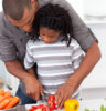 father son cooking