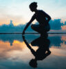Silhouette of Women and shadow reflected in water