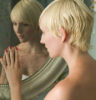 woman looking in the mirror
