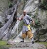 monk standing on a rock