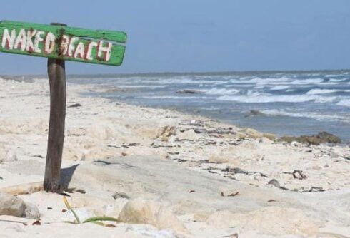naked beach sign