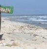 naked beach sign