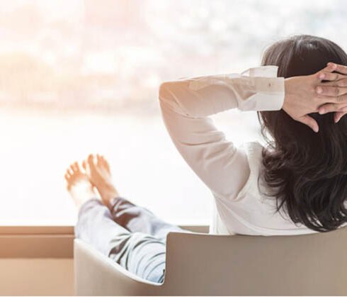 pjurmed woman sitting on a chair