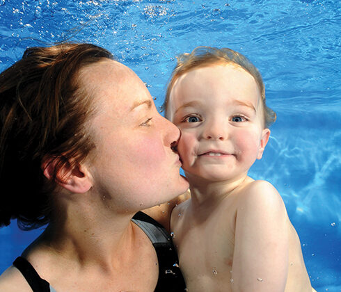 woman and baby swimming