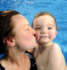 woman and baby swimming